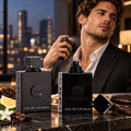 A black glass cologne bottle on a marble table with a man in the background