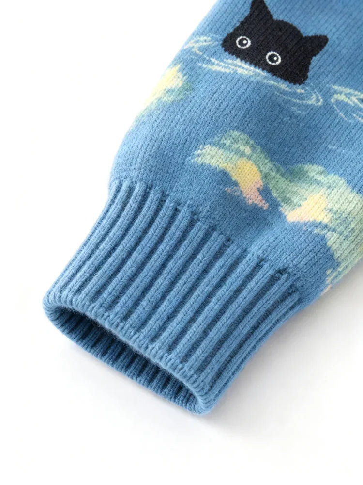 Close-up view of the ribbed cuff on a blue knitted sweater