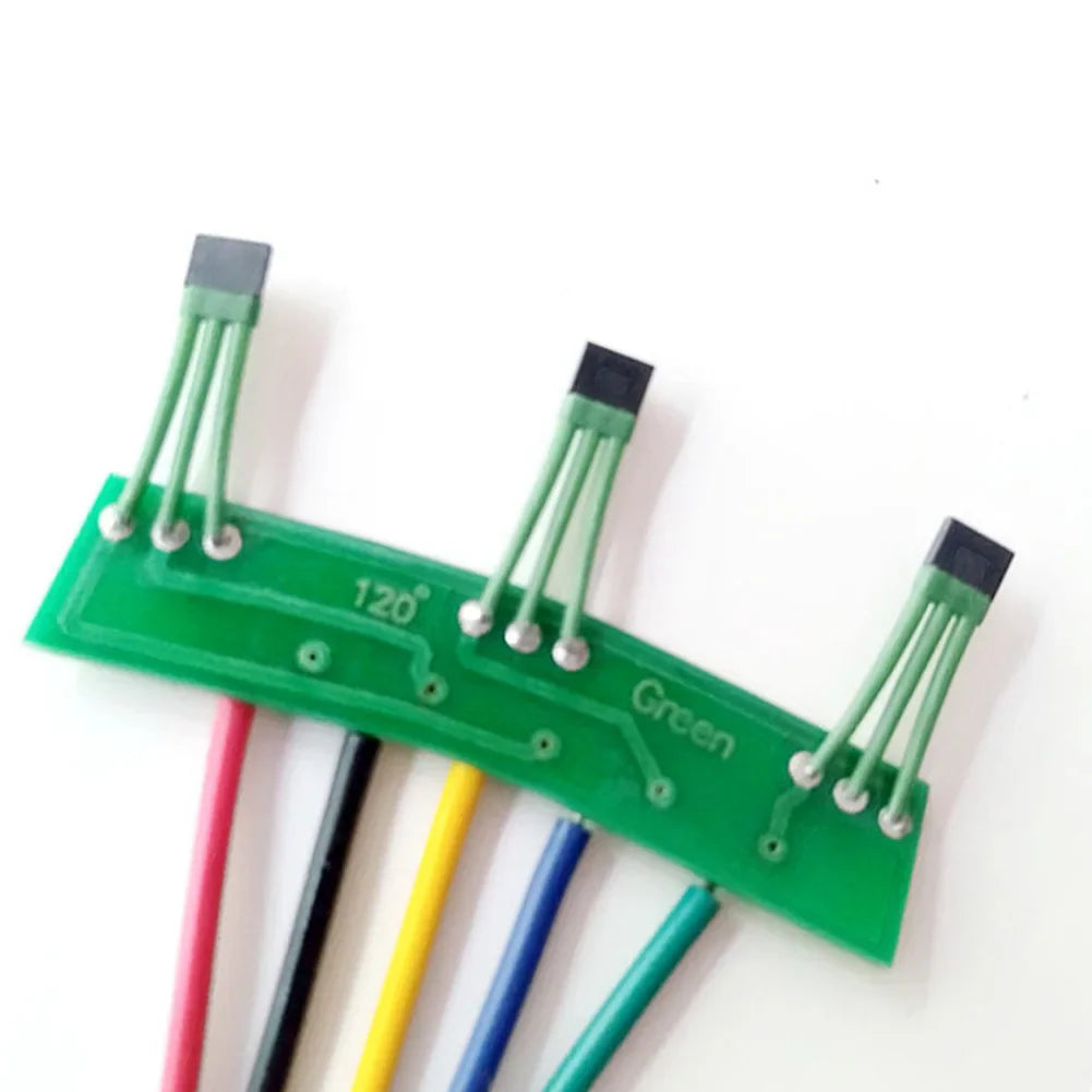 Reverse side of green PCB hall sensor board with motor component markings