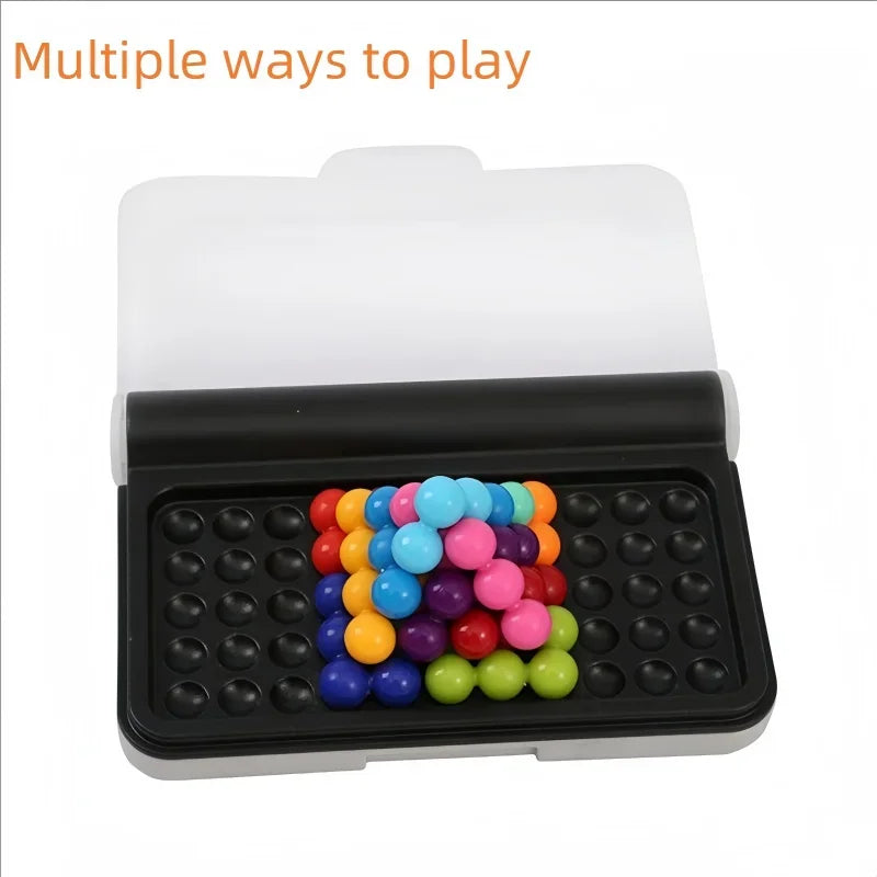 3D pyramid puzzle partially assembled on a black game board in a storage box