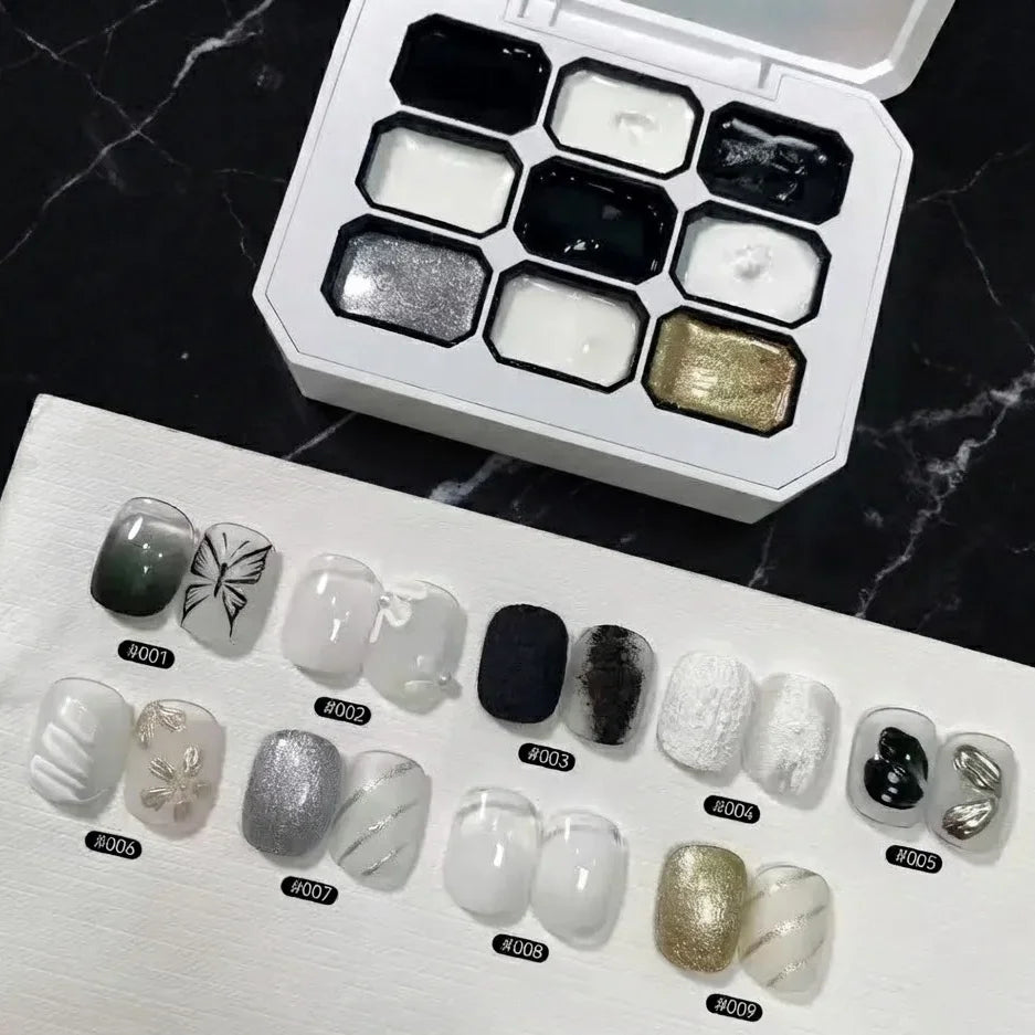 A solid gel nail polish palette shown with nine numbered nail art tips displaying various black and white designs.