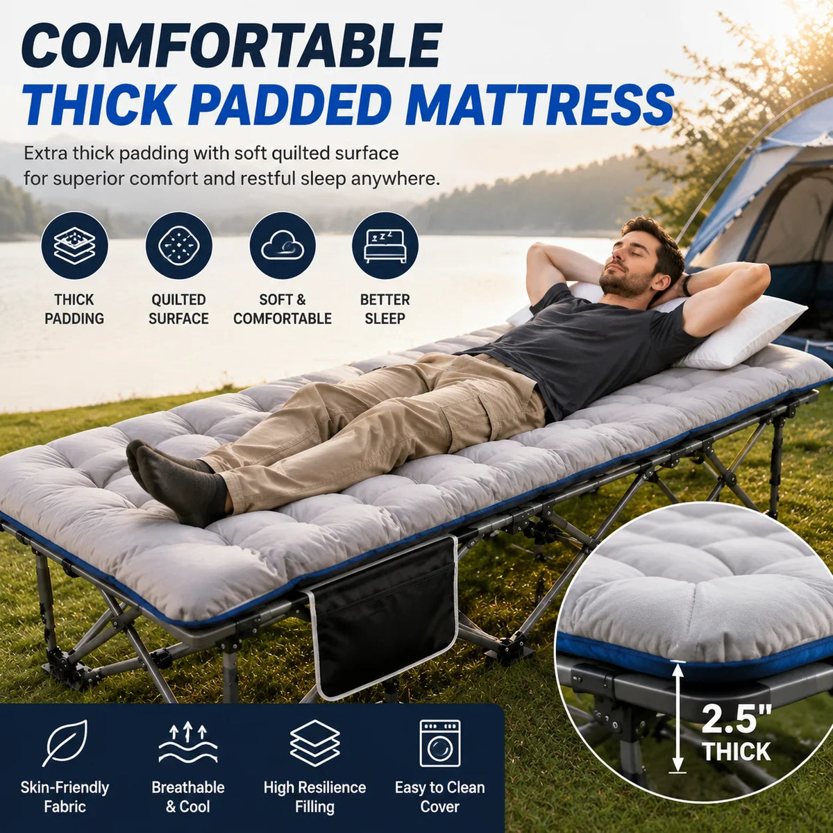 A man resting on a portable camping cot with a grey padded mattress in a camping setting.