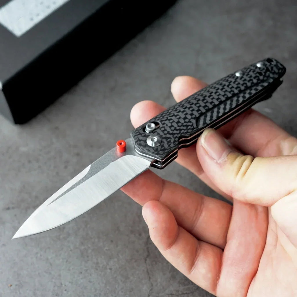 Open tactical folding knife with a carbon fiber handle and M390 blade