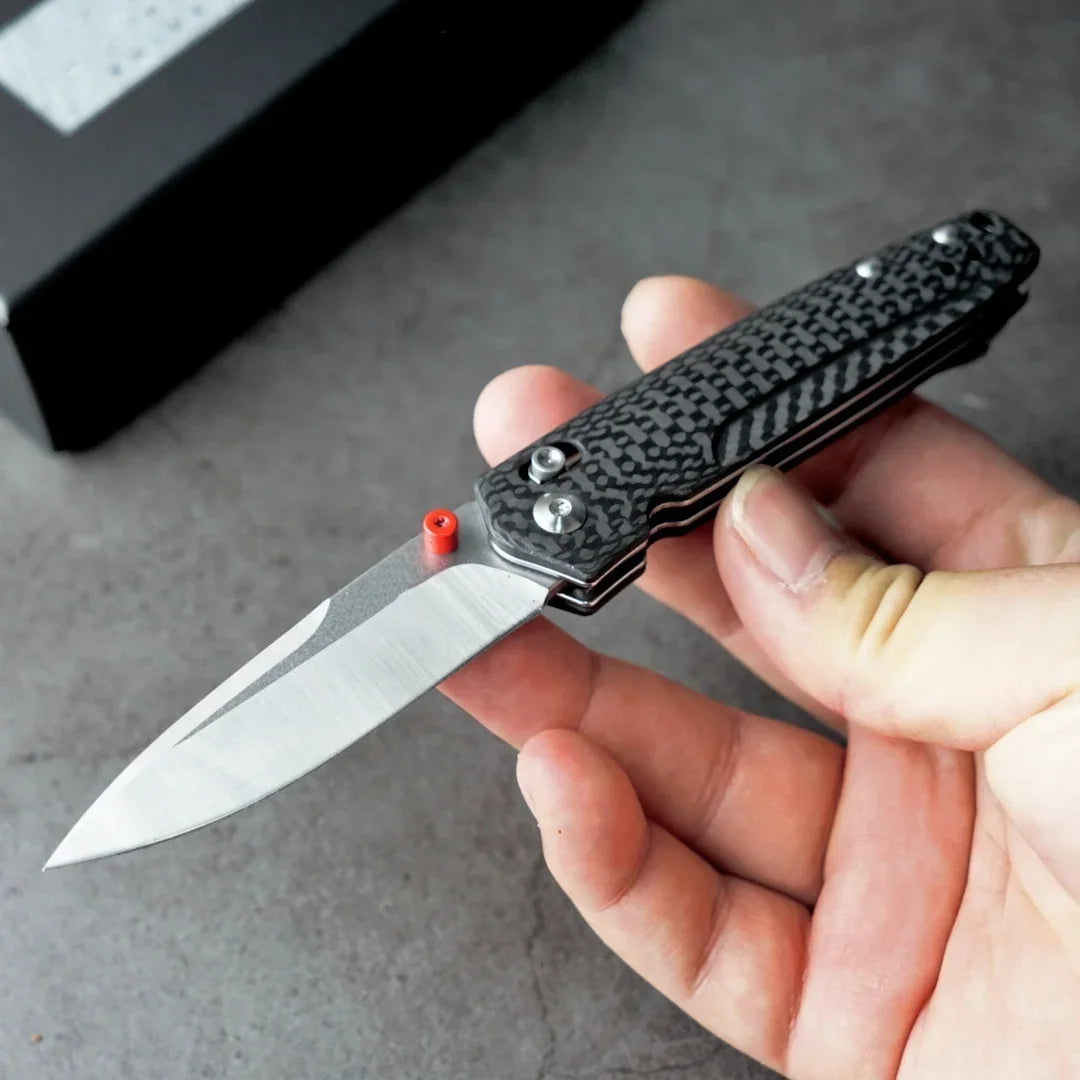 Open tactical folding knife with a carbon fiber handle and M390 blade