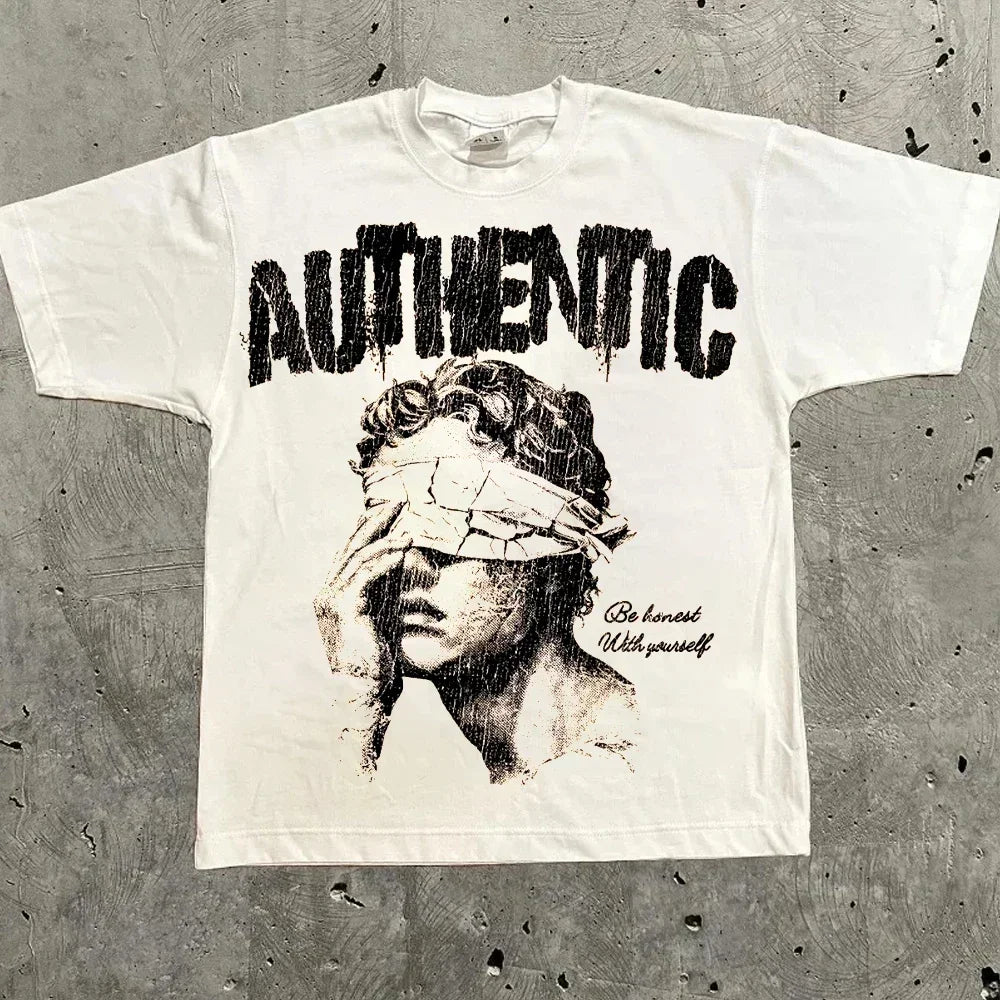 White oversized t-shirt with a blindfolded statue graphic and 'Authentic' text