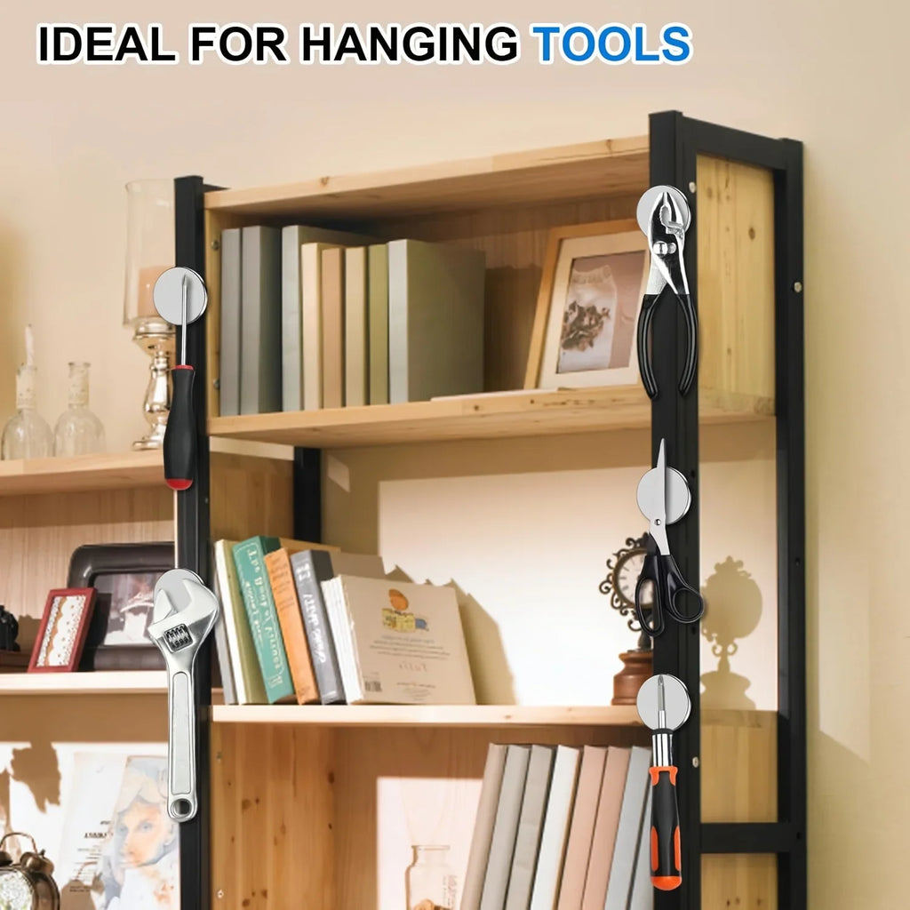 Round magnets being used to hang various metal hand tools on a wooden shelf