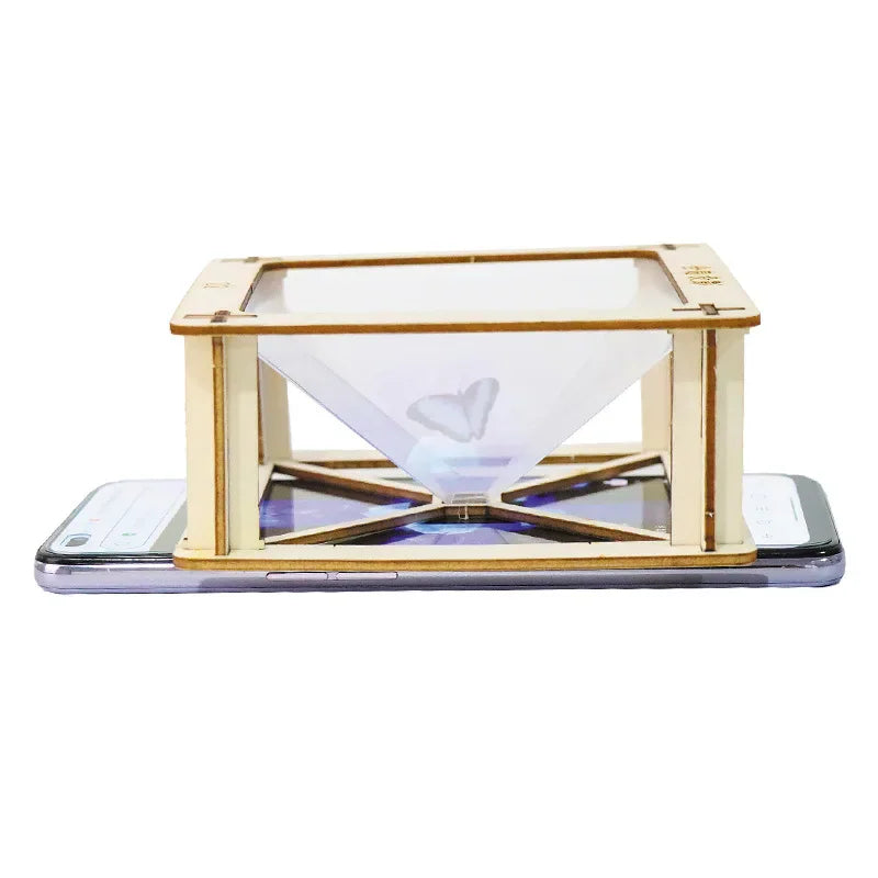 Wooden DIY 3D holographic projection pyramid stand resting on a smartphone screen