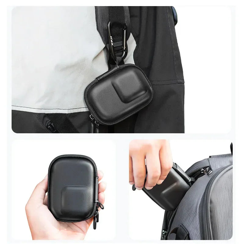 Portable black action camera hard case with carabiner attached to a bag