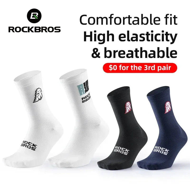 White, black, and navy blue cycling socks with dinosaur graphics