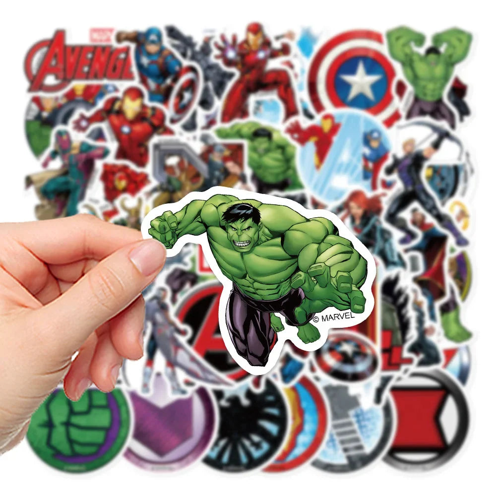 A hand holding a Hulk superhero sticker with other character stickers in the background