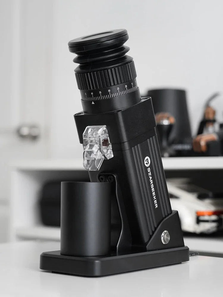 Black electric coffee grinder with adjustable settings on a kitchen counter
