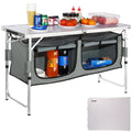 Folding aluminum camping table with under-table storage compartments and food items on top
