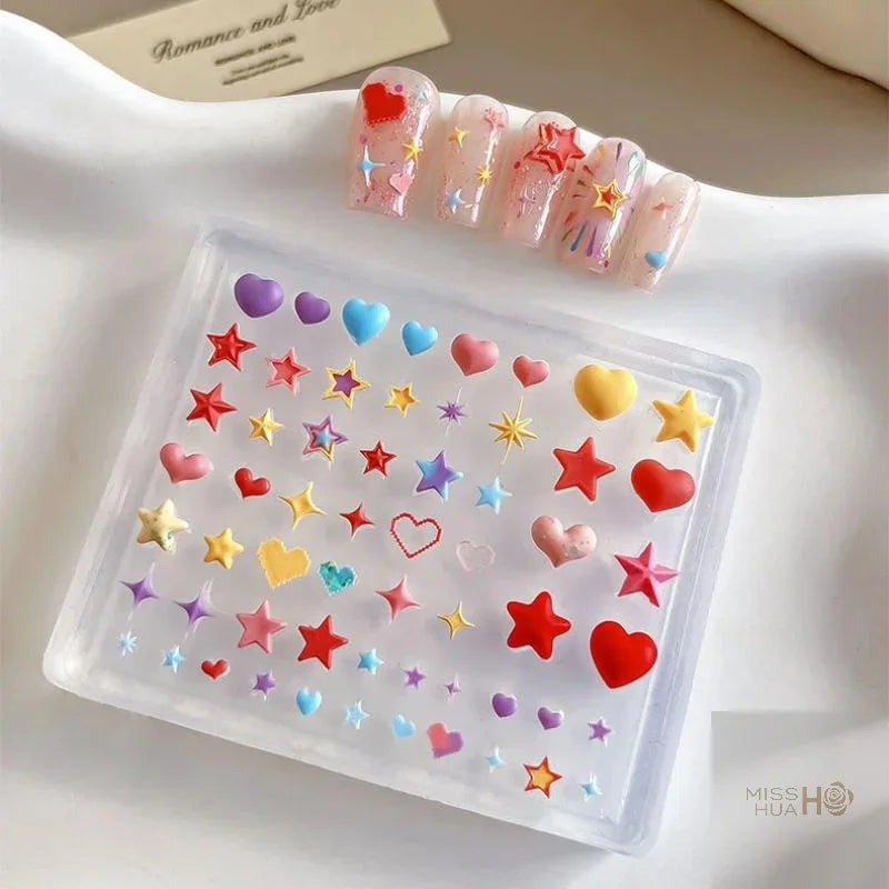 Transparent silicone mold for 3D heart and star nail art decorations with finished sample nails