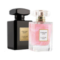 A black bottle of For One Night perfume and a pink shimmer bottle of Forever Love perfume.