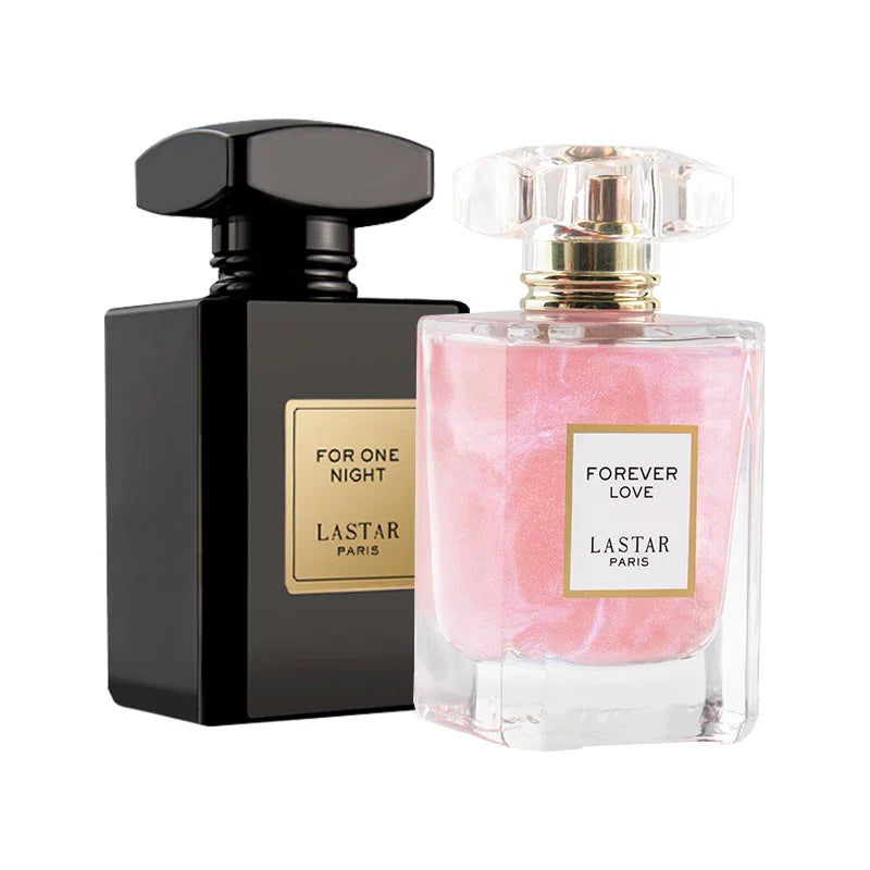 A black bottle of For One Night perfume and a pink shimmer bottle of Forever Love perfume.