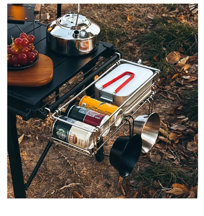 Camping table extension side rack holding food items and cookware