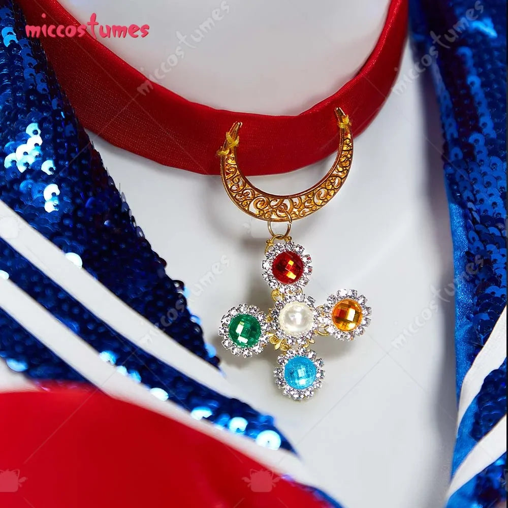 Close-up of a red choker with a moon and gemstone cross pendant