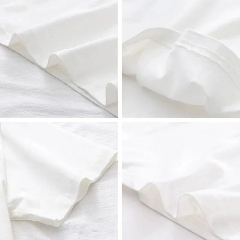 Close-up details of the fabric and stitching of a plain white t-shirt