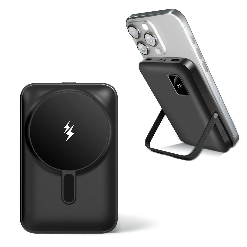 Black magnetic portable wireless power bank with foldable kickstand attached to a smartphone
