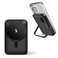 Black magnetic portable wireless power bank with foldable kickstand attached to a smartphone