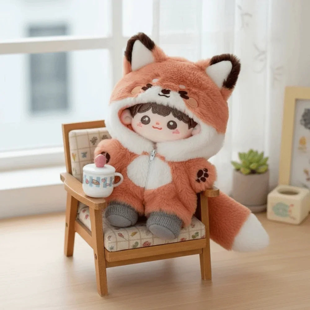 20cm doll wearing a plush fox jumpsuit sitting in a miniature chair