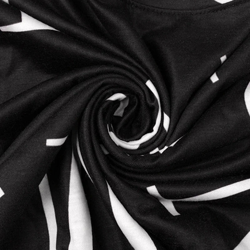 Close-up of black fabric with white letter print
