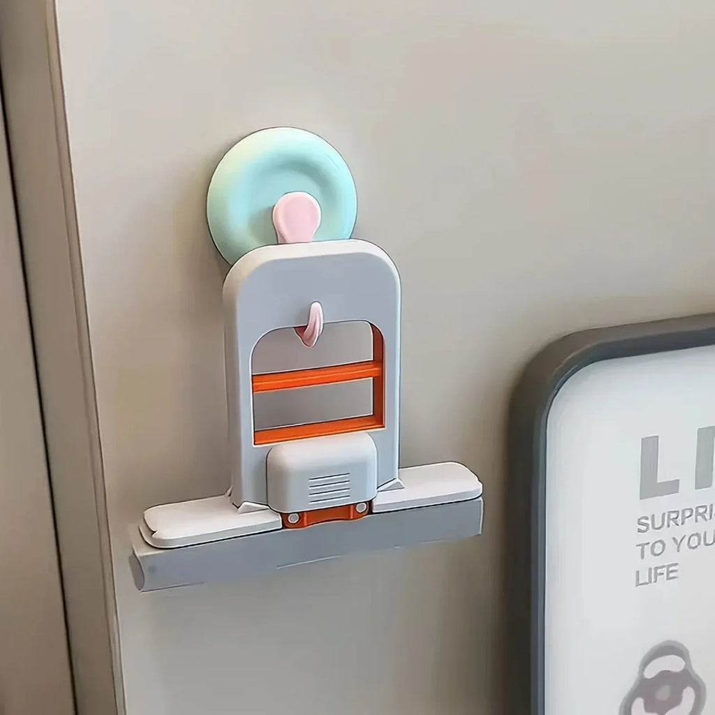 A handheld sponge mop hanging on a wall surface