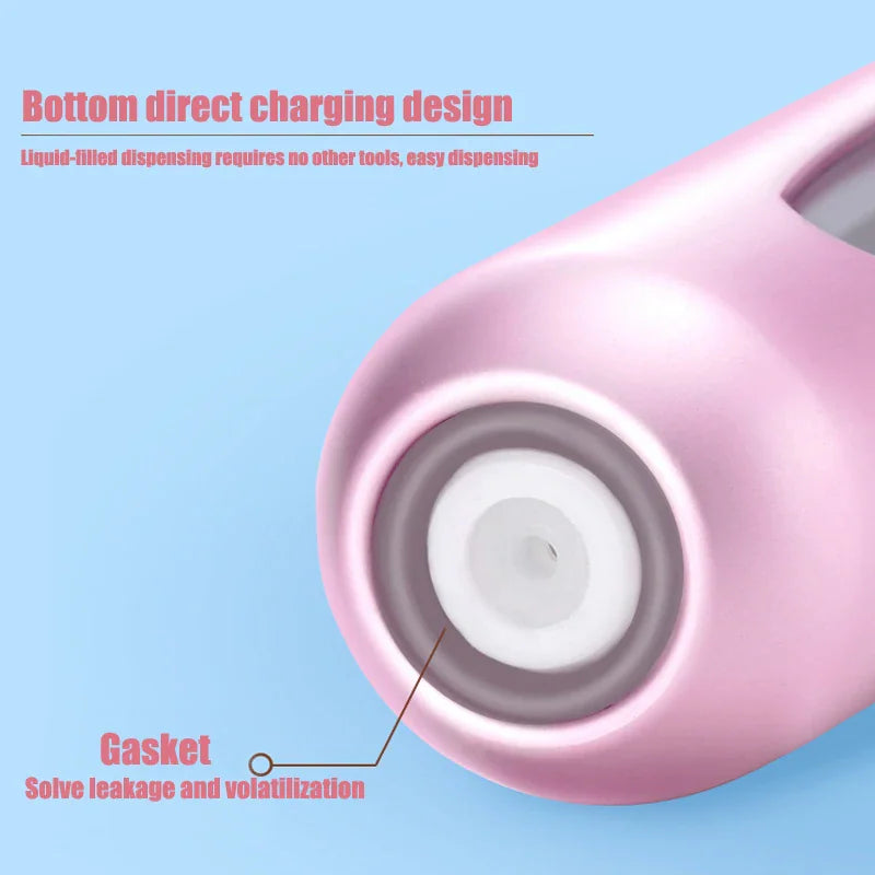 Close-up view of the bottom-filling mechanism and sealing gasket of a pink perfume atomizer.
