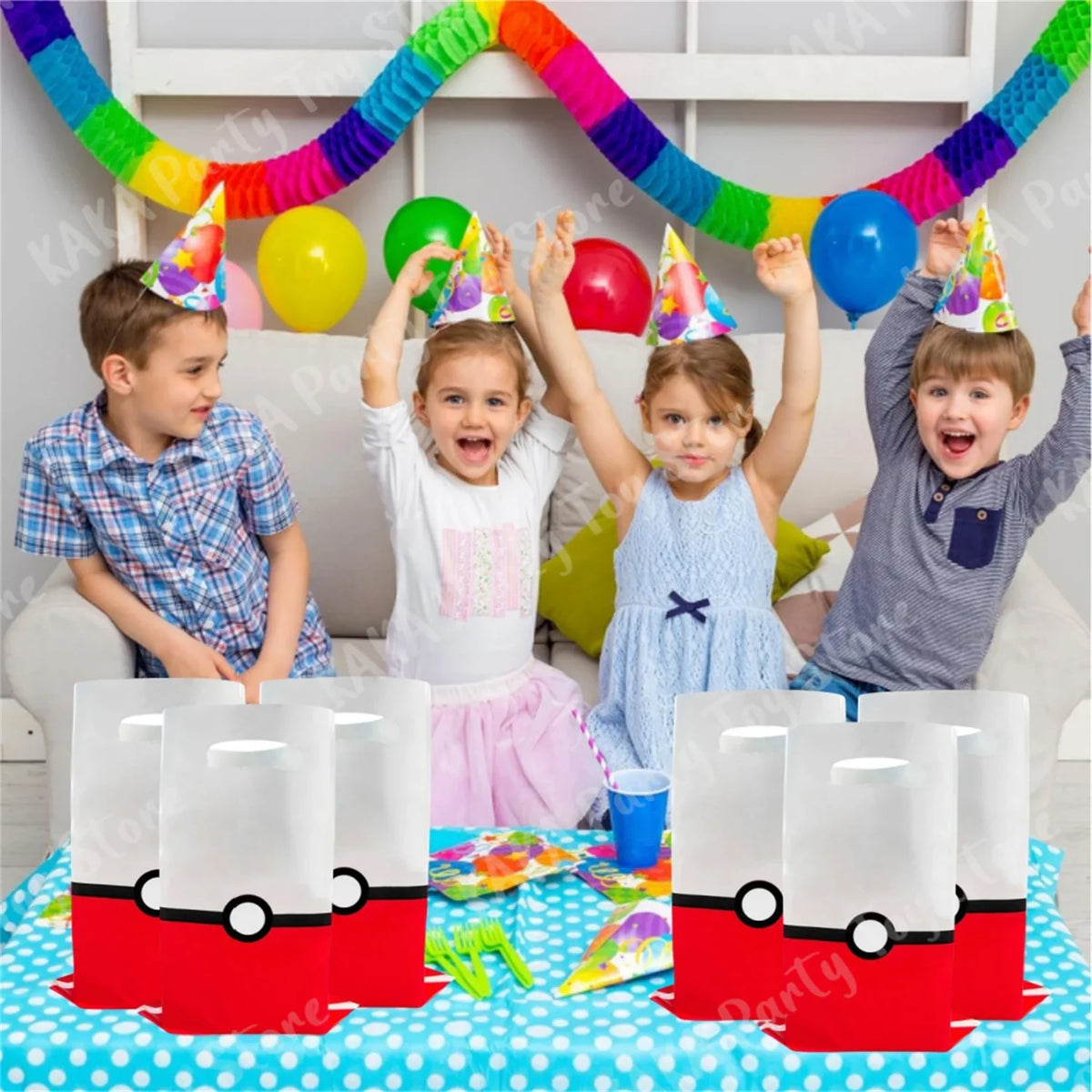 Children at a birthday party sitting at a table with pokeball theme gift bags