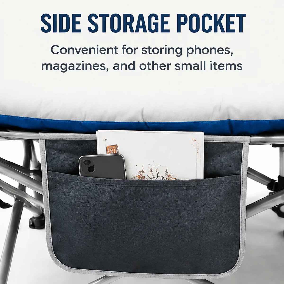 Side storage pocket on a foldable camping cot containing a mobile phone and a magazine.