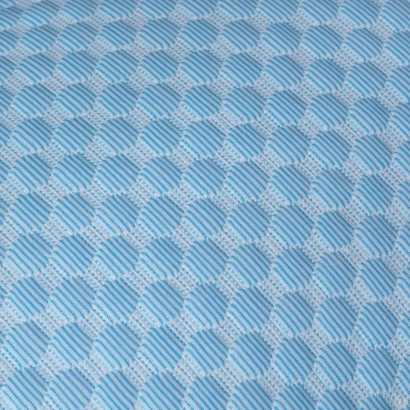 Close-up of blue and white textured honeycomb fabric pattern