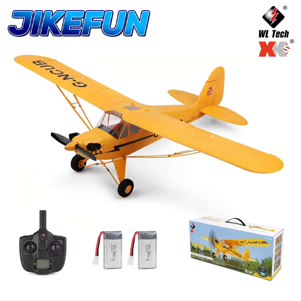 Yellow radio-controlled airplane with remote control, batteries, and box