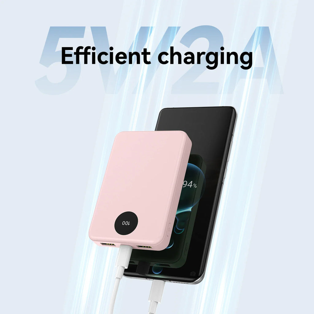 A pink portable power bank charging a smartphone.