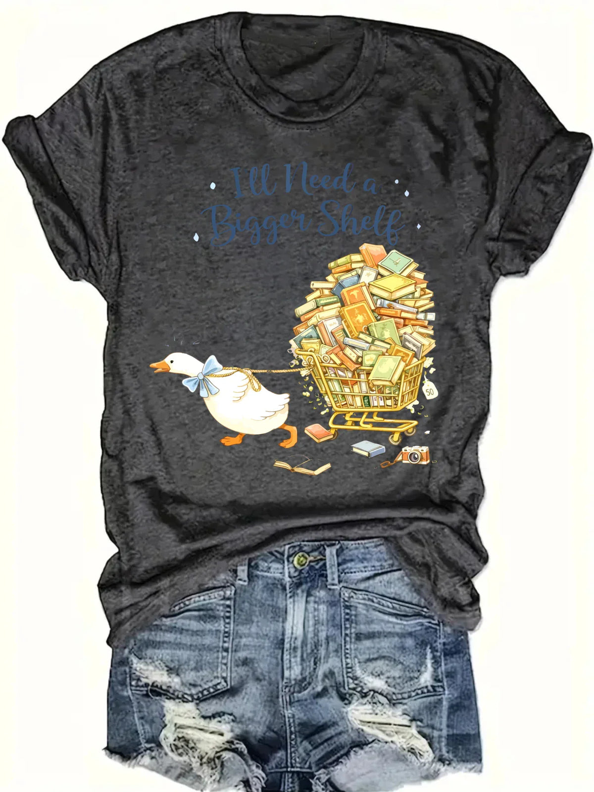 Dark grey short-sleeved t-shirt with a duck pulling a book cart graphic print, styled with denim shorts