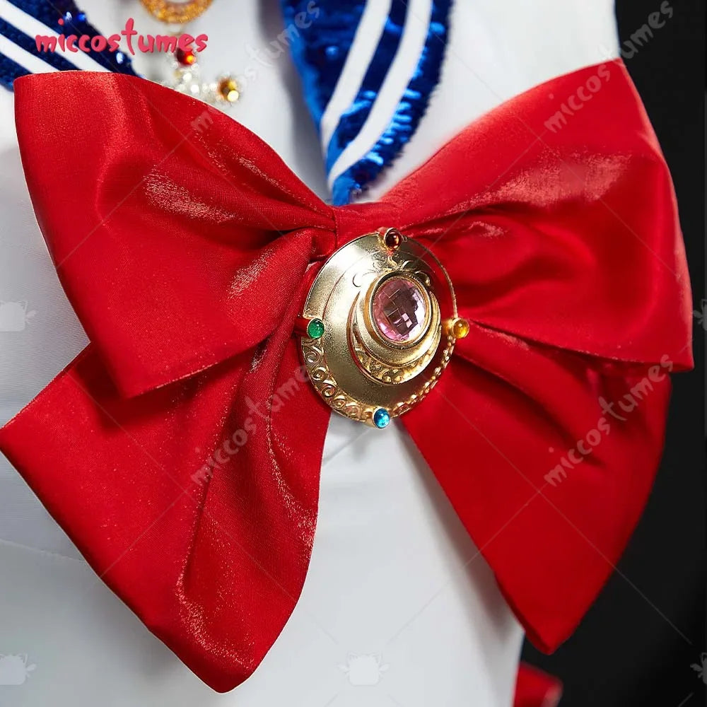 Close-up of a large red bow brooch with a golden sailor-themed pendant