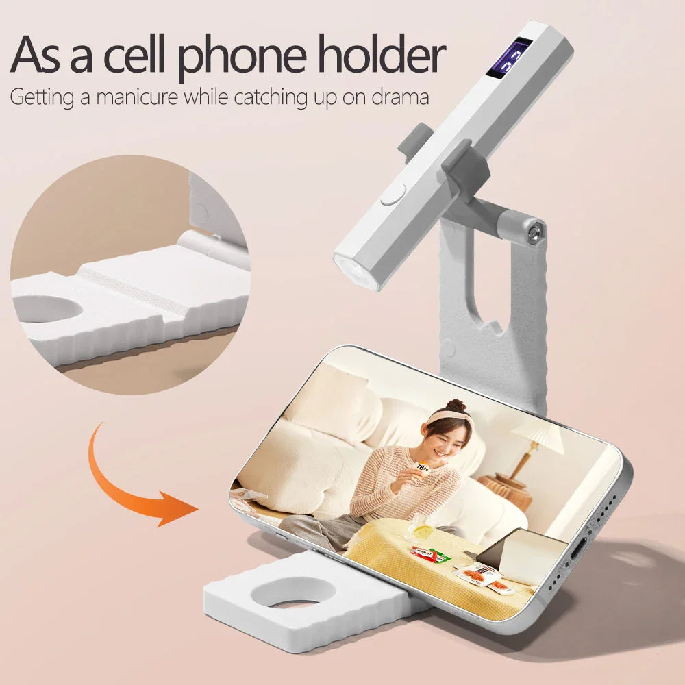 Portable LED UV nail lamp used as a phone stand for watching videos during a manicure