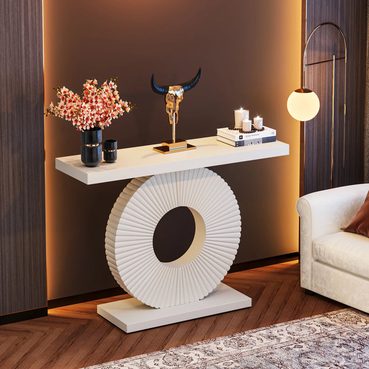 Modern white console table with a circular fluted base styled in a living room