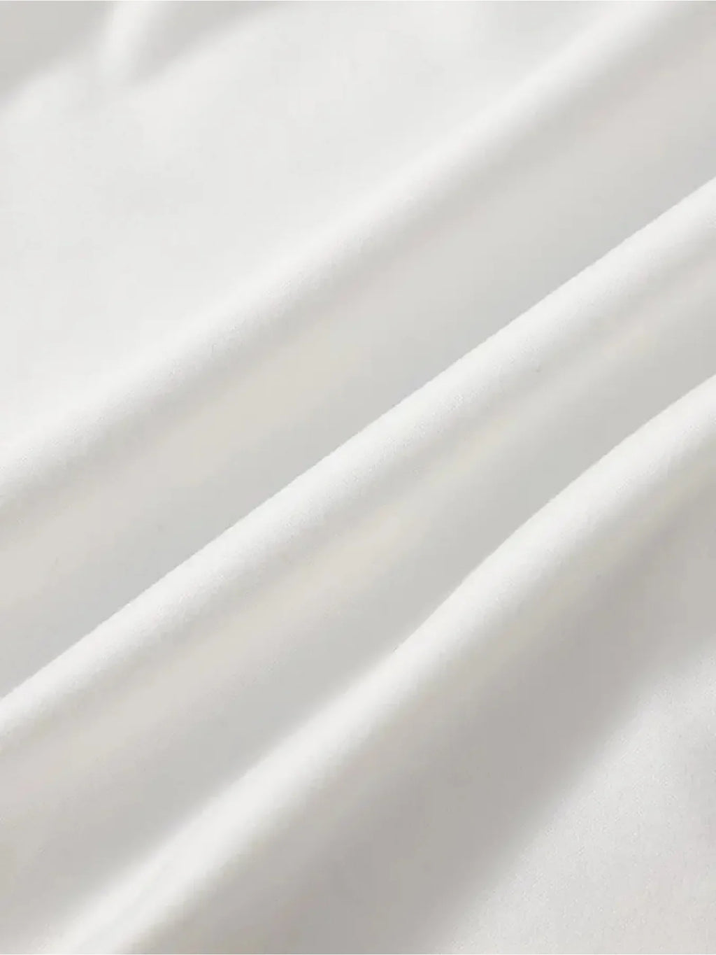 Close up of folded white t-shirt fabric