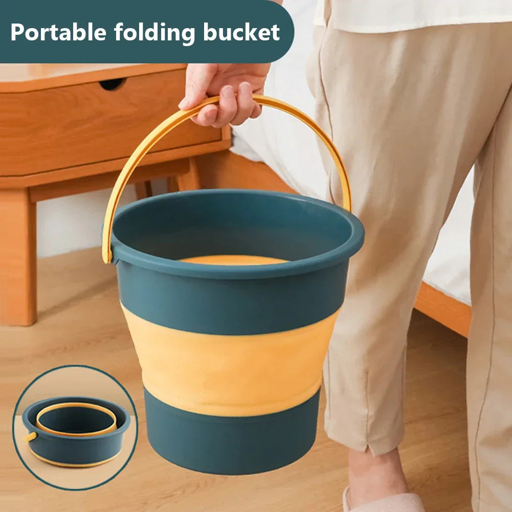 Hand holding a collapsible bucket in blue and yellow