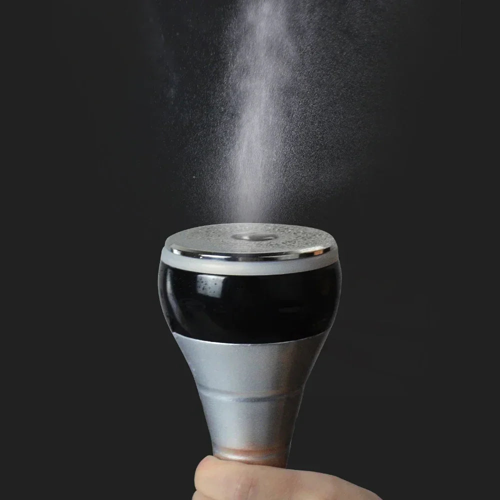 Close up of the ultrasonic cavitation machine probe head releasing mist