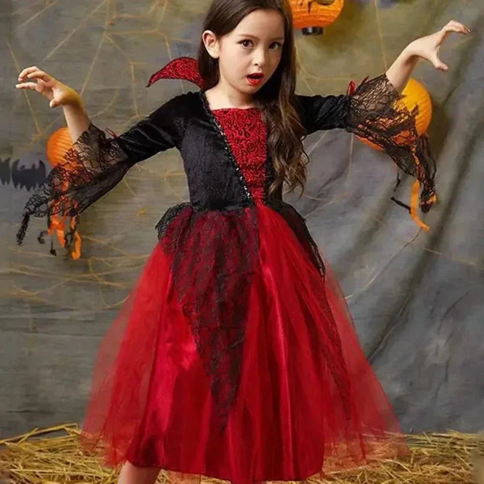 Girl wearing a red and black gothic vampire dress for Halloween