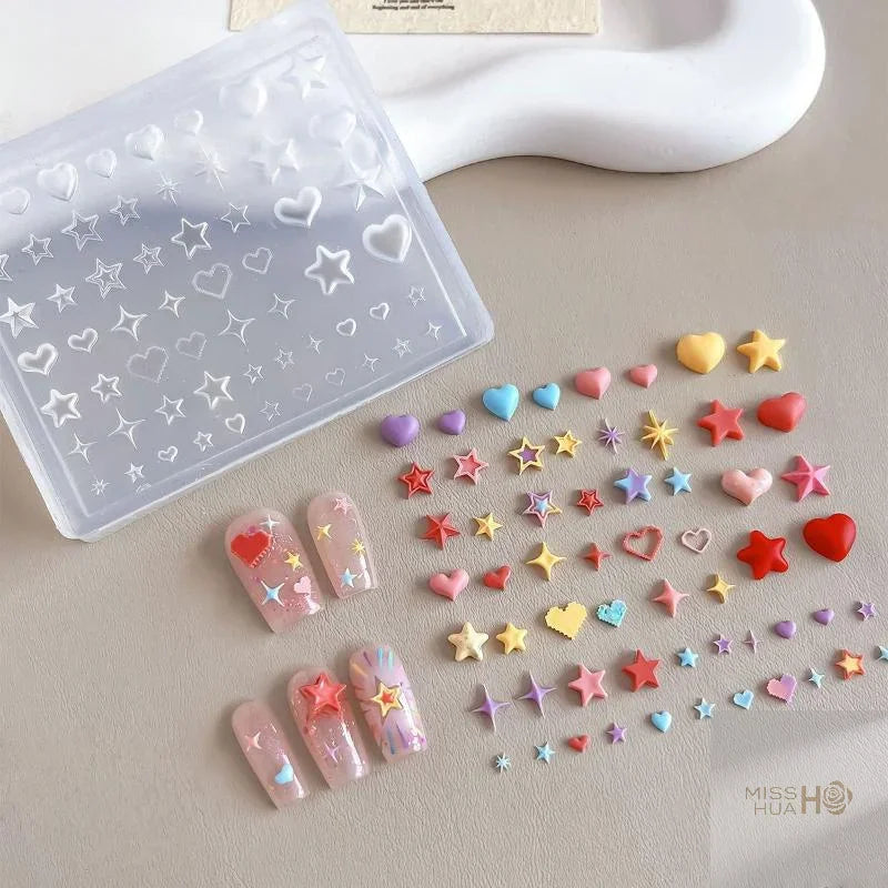 Transparent silicone mold for 3D heart and star nail art decorations with finished sample nails