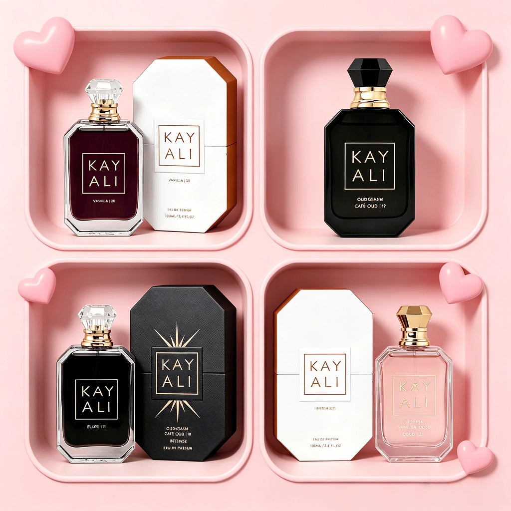 Selection of four different perfumes with their boxes, displayed in pink compartments with heart decorations.