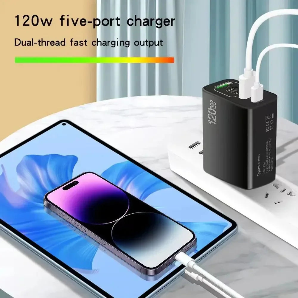 Black 120W five-port fast charger connected to a tablet and smartphone