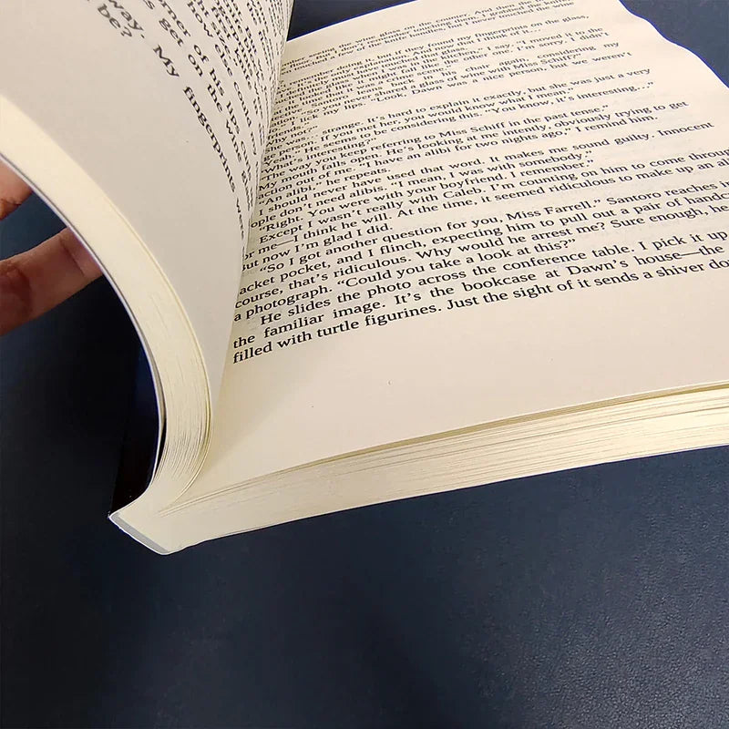 Opened pages of a novel displaying a narrative scene.