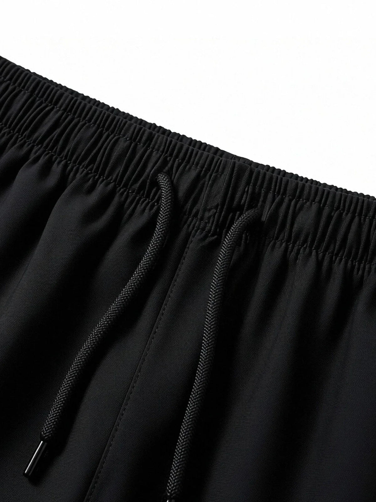 Close-up of black shorts elastic waistband with adjustable drawstring