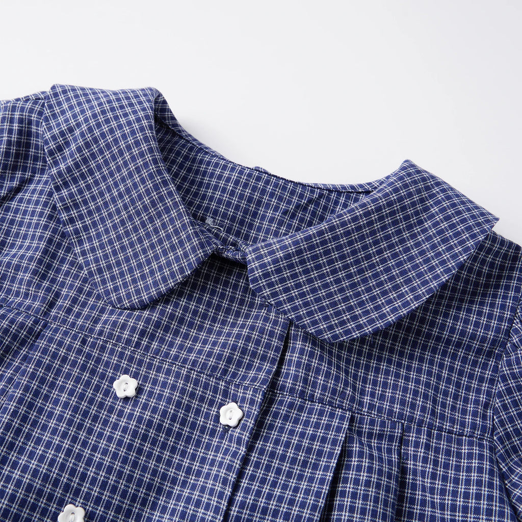 Collar and upper front detail of blue plaid short-sleeve shirt