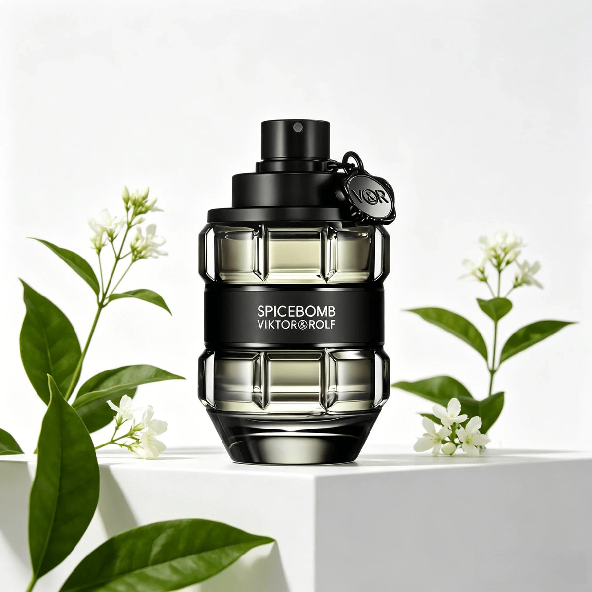 A glass perfume bottle shaped like a grenade, in a transparent black finish with a black band, on a white pedestal with