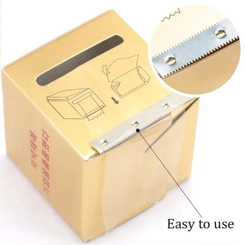 Close-up of the metal cutting blade on a gold plastic wrap dispenser box