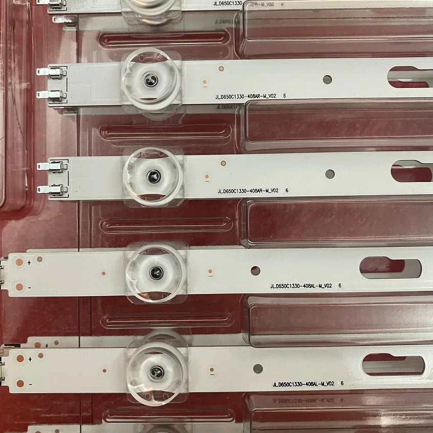 Close-up of LED light bars for television repair, showing connector pins and circuit board details.